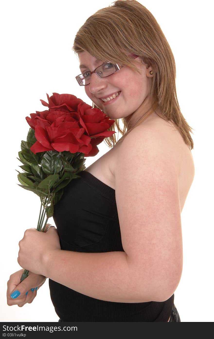 Smiling teenager holding a bunch of red roses to her chest, smiling into the camera, in closeup and with glasses, for white background. Smiling teenager holding a bunch of red roses to her chest, smiling into the camera, in closeup and with glasses, for white background.