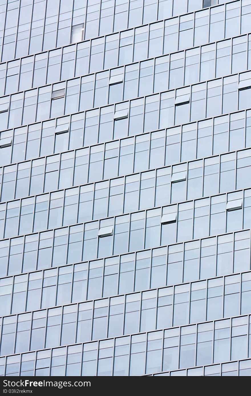 Silver office building glass wall in shenzhen, china.