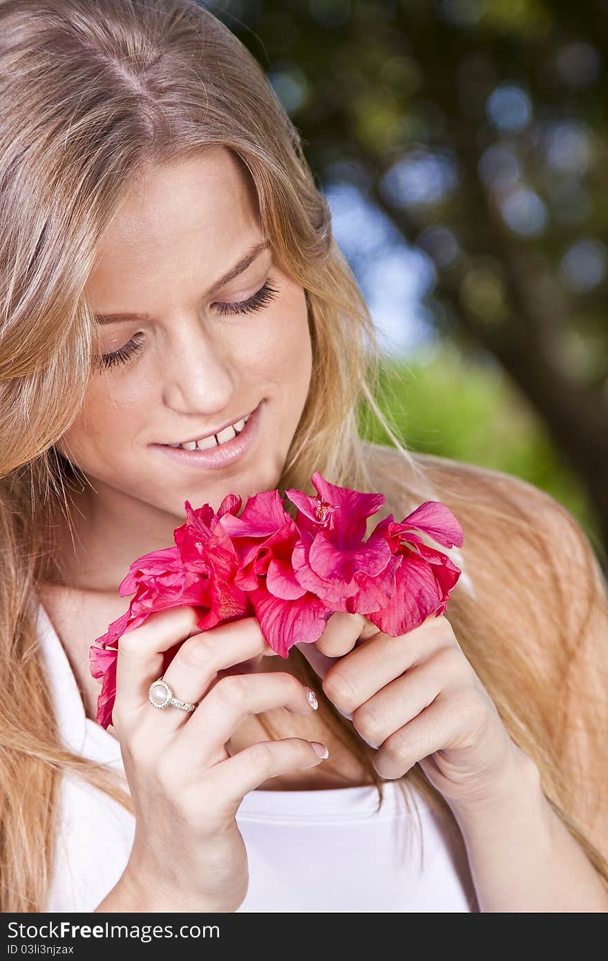 Portrait of a beauty blonde girl with flower