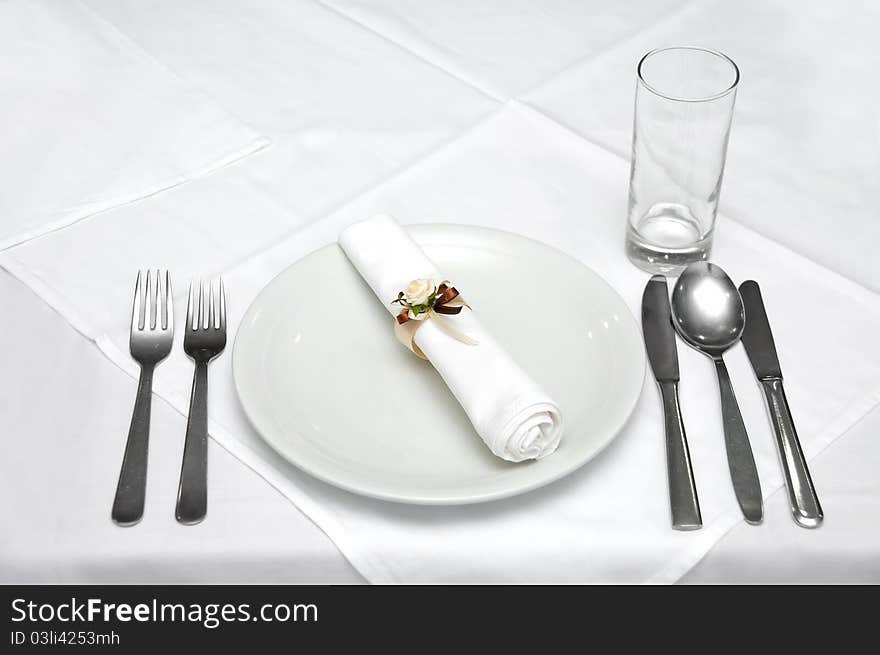 Celebration table with basic cutlery and glass prepared