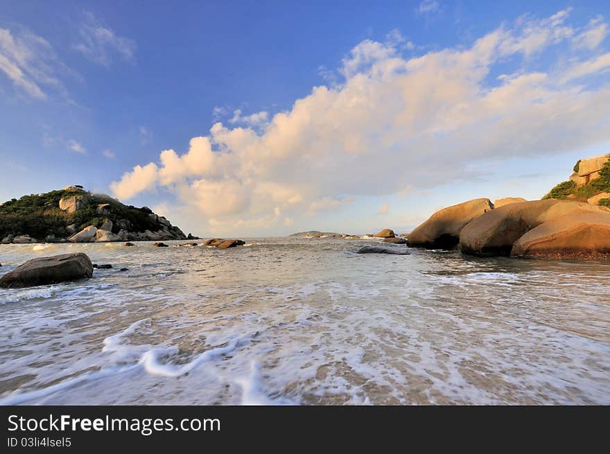 Sea coast in sunrise lighting