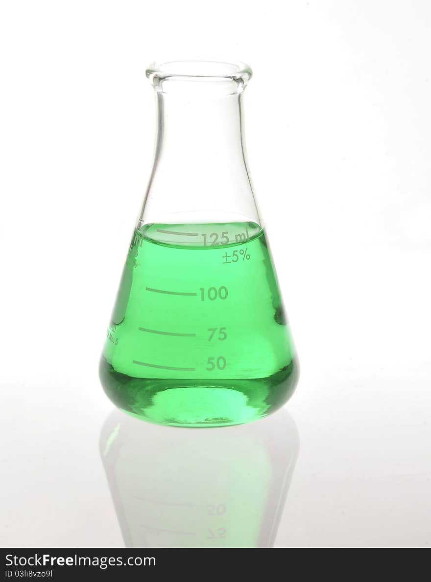 Beaker with green compound substance. Beaker with green compound substance