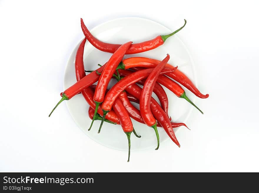 An image of red peppers in white bowl. An image of red peppers in white bowl