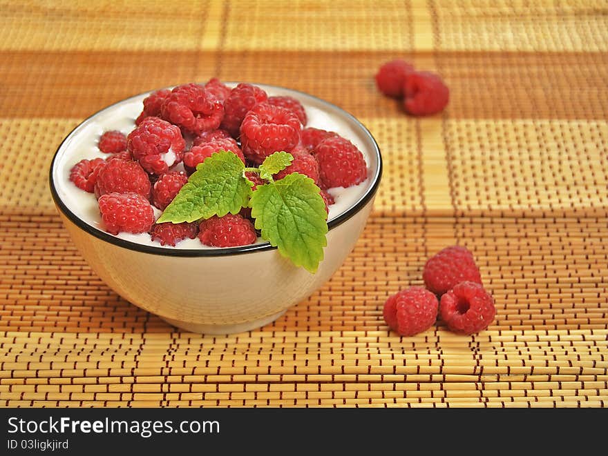 Raspberries in milk