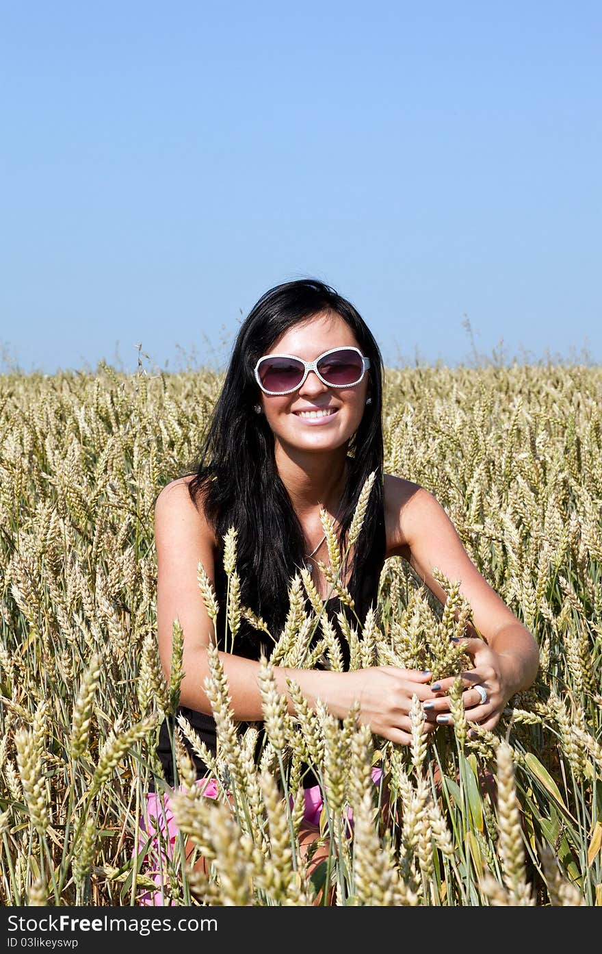 Happy girl in the  wheat field