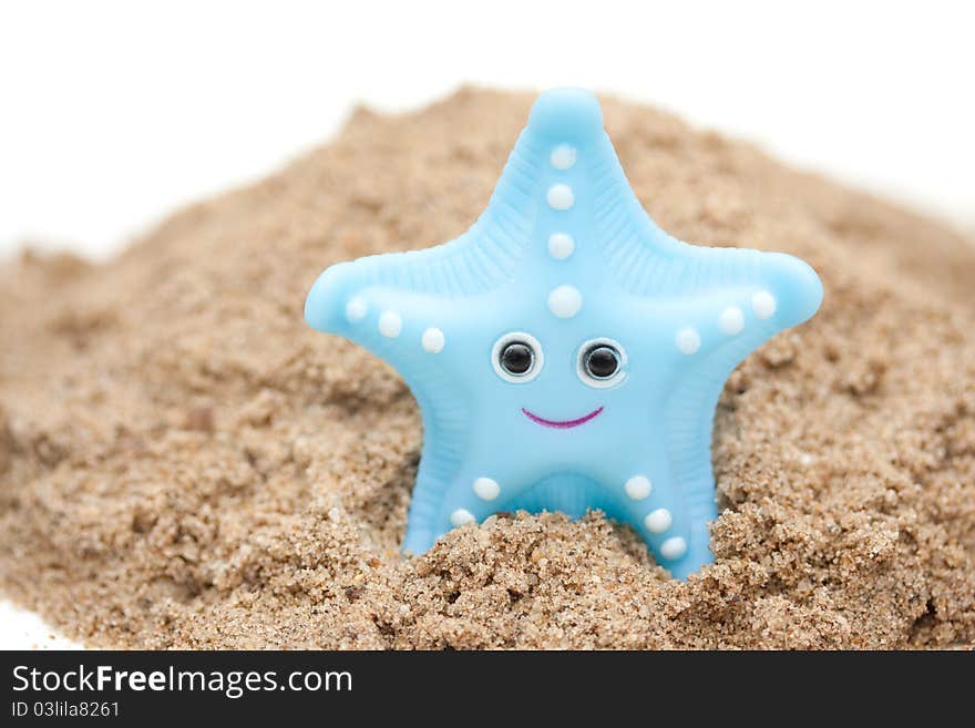 A plastic starfish on the beach