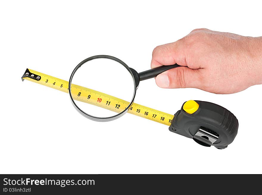 Measuring tool a roulette and magnifier in hand isolated on white background. Measuring tool a roulette and magnifier in hand isolated on white background