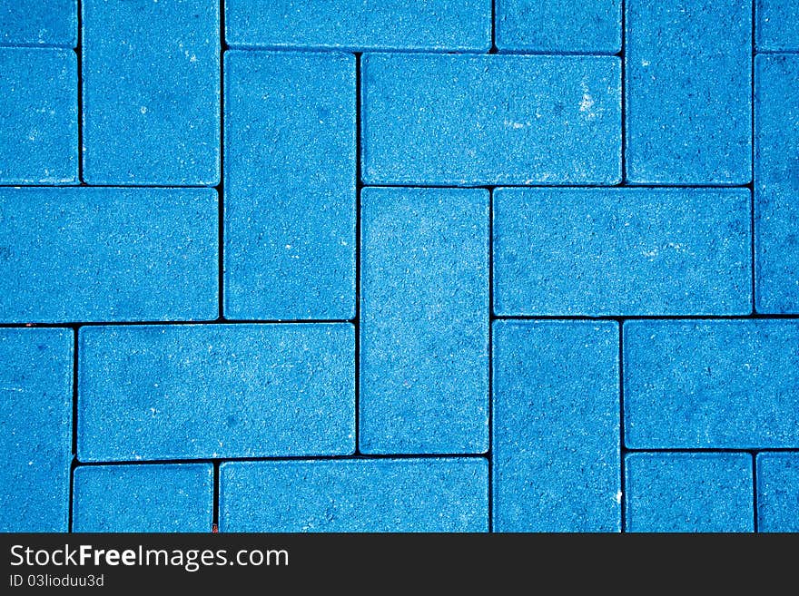 Pavement pattern made with cast concrete blocks in blue color