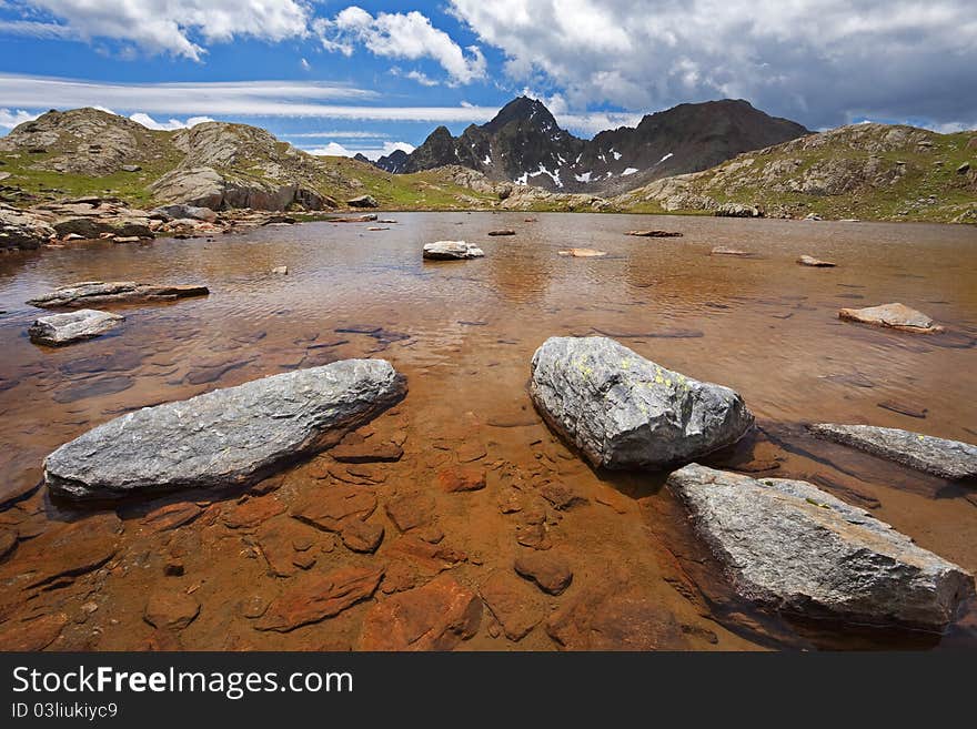 Small icy mountain lakes after a frozen night during summer. Small icy mountain lakes after a frozen night during summer