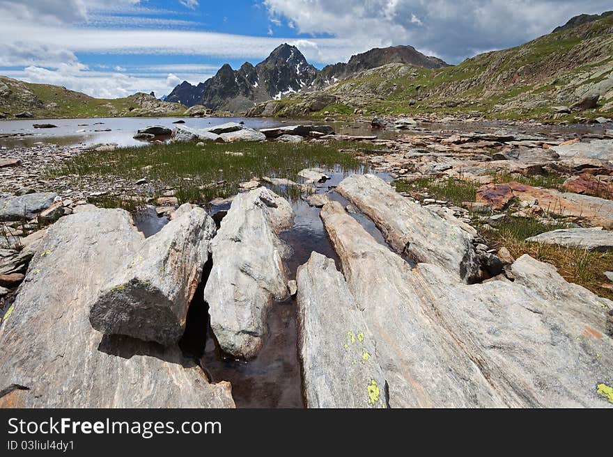 Small icy mountain lakes after a frozen night during summer. Small icy mountain lakes after a frozen night during summer