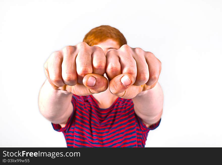 Cute boy with fist isolated on white background