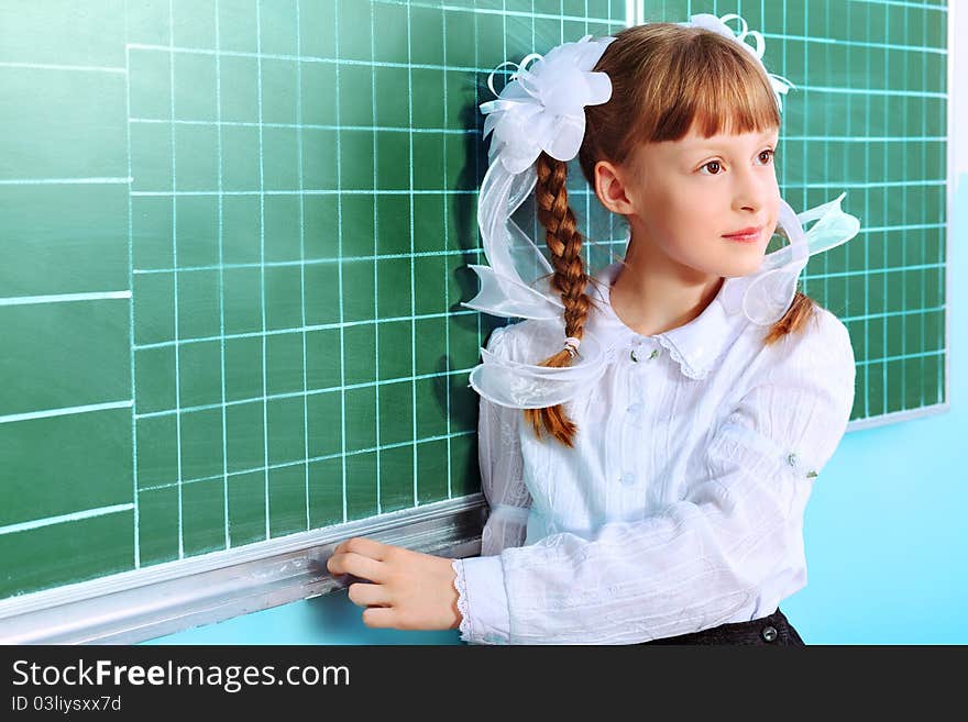 Portrait of a pretty schoolgirl in a classroom. Portrait of a pretty schoolgirl in a classroom.