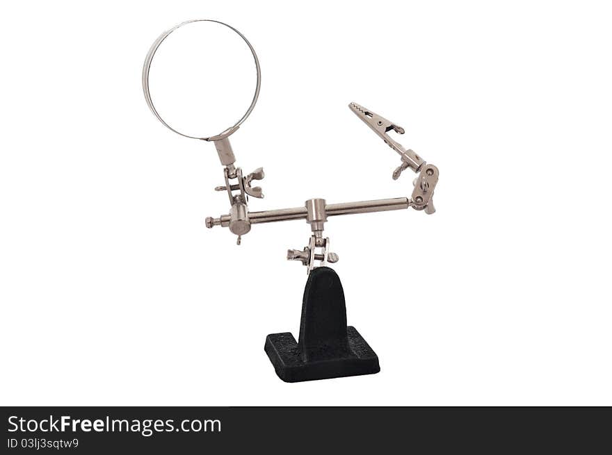 Magnifying glass with a clamp on the stand on a white background