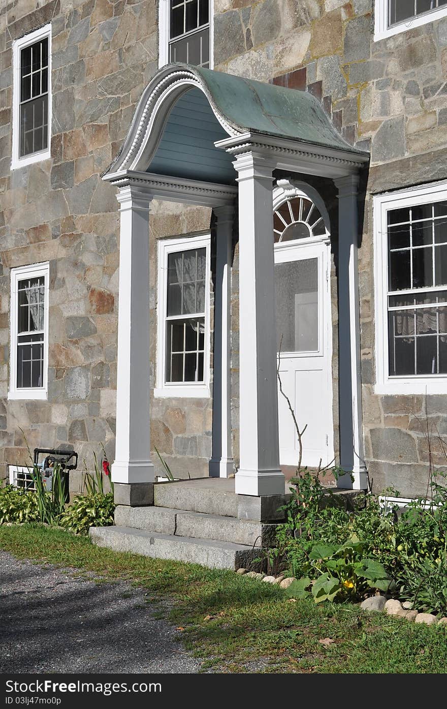 Brilliant spring sunshine enlightens the historic fieldstone mansion on Great Road in Lincoln. Brilliant spring sunshine enlightens the historic fieldstone mansion on Great Road in Lincoln