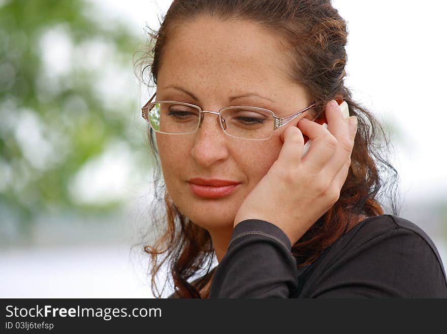 This photograph shows a beautiful girl in the park.