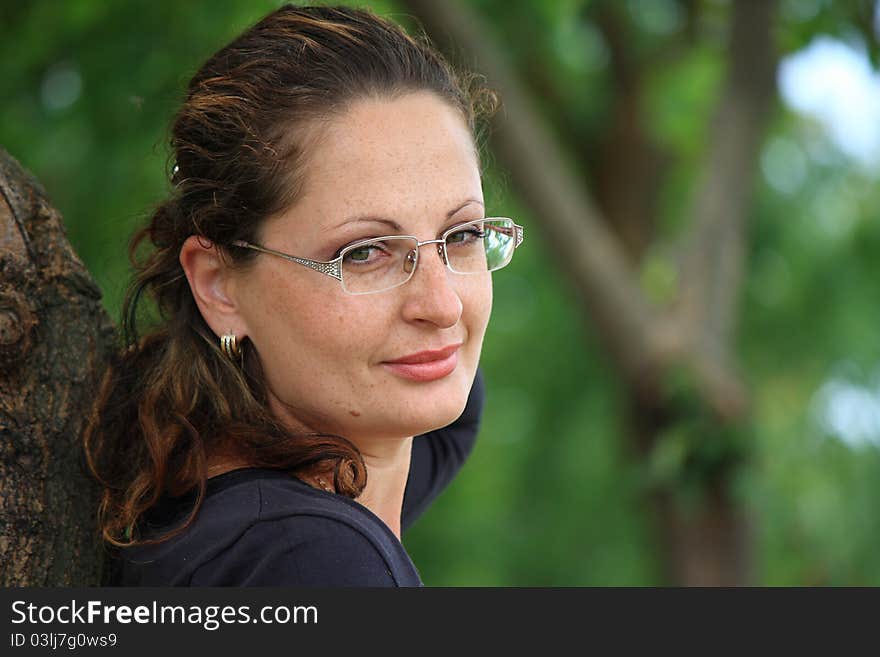 This photograph shows a beautiful girl in the park.