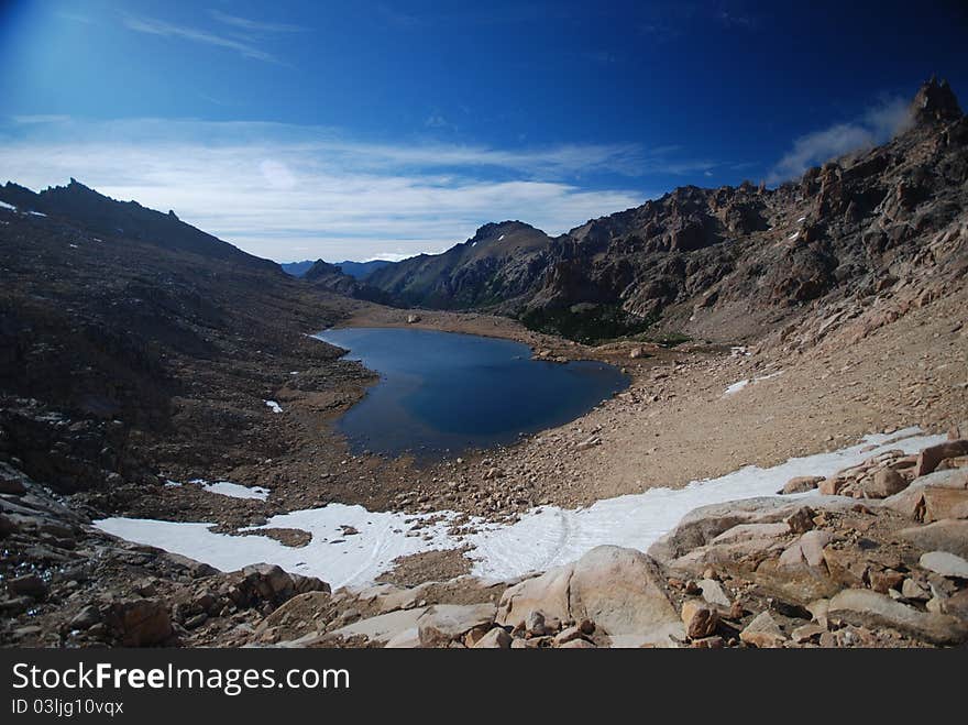 Dark lake and mountains landscape