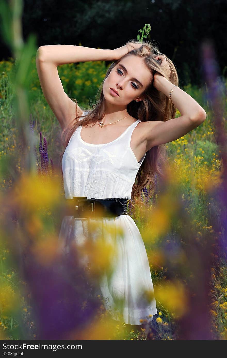 Young beautifull girl at the meadow. Young beautifull girl at the meadow