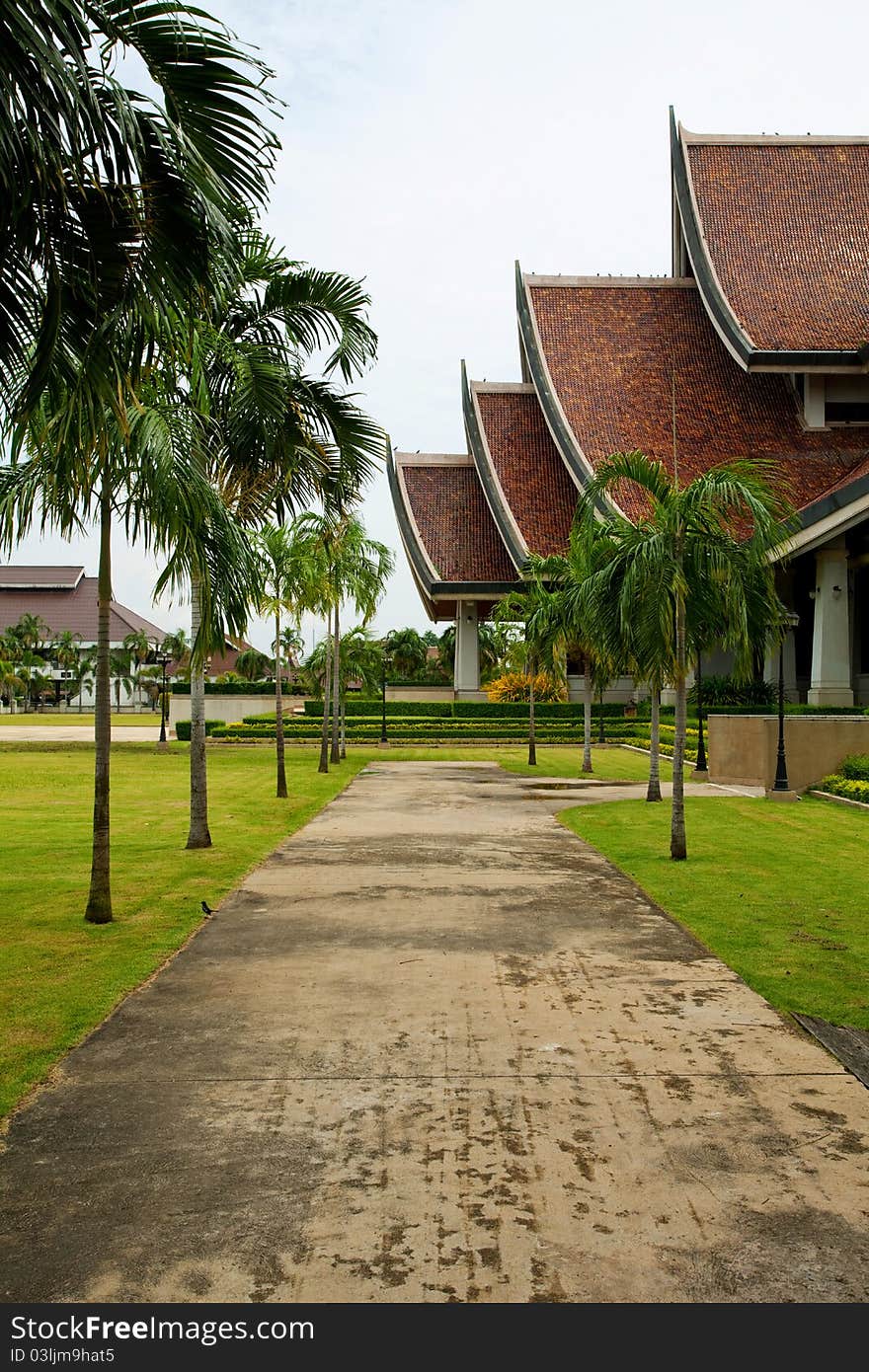 Walkway in temple with palm trees