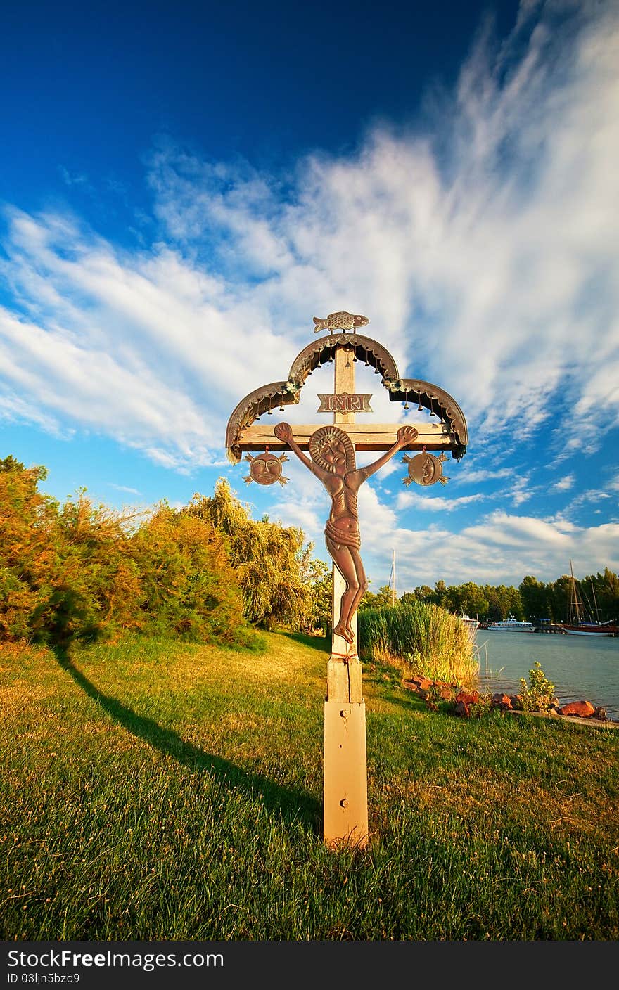 Nice cross in the island with fantastic clouds