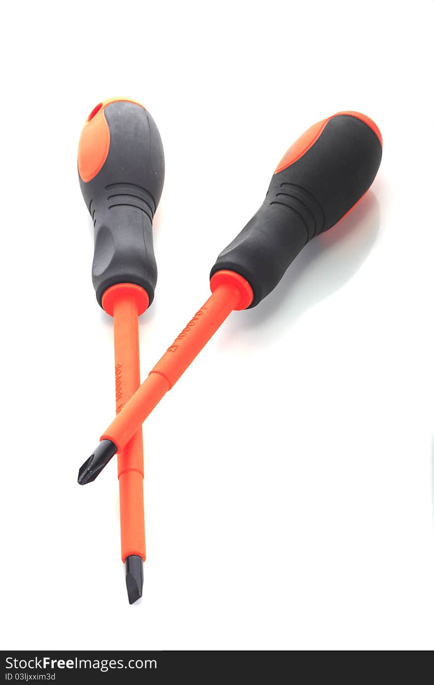 Two electrical screw driver, type flat and philip. orange colour with hand grip, colour black. Isolated white background. Two electrical screw driver, type flat and philip. orange colour with hand grip, colour black. Isolated white background.