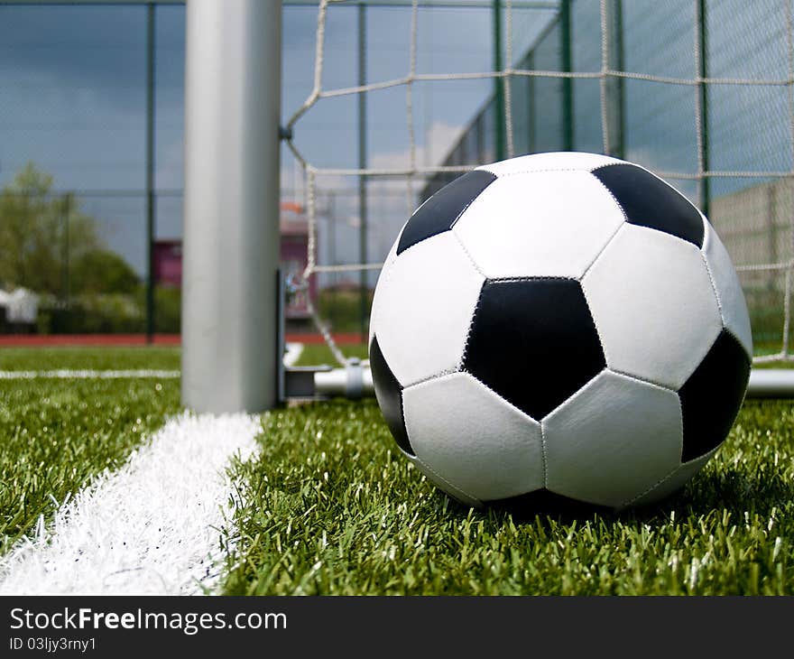 Photo of football against the gate. Photo of football against the gate