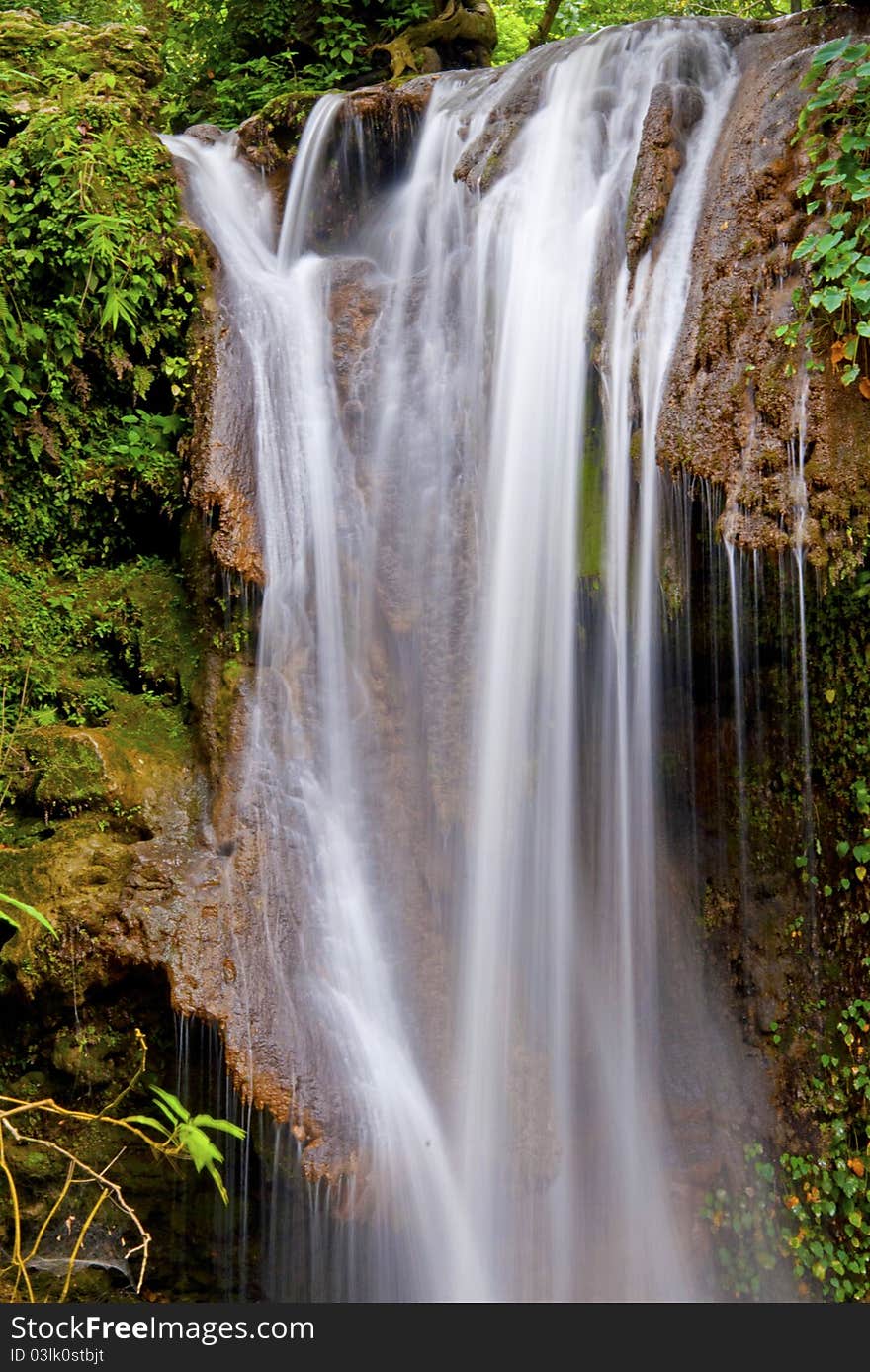 Water fall at Jim Corbett National Park, Ramnagar, india with beautiful white water flowing between lush green forest and rocks. Water fall at Jim Corbett National Park, Ramnagar, india with beautiful white water flowing between lush green forest and rocks.