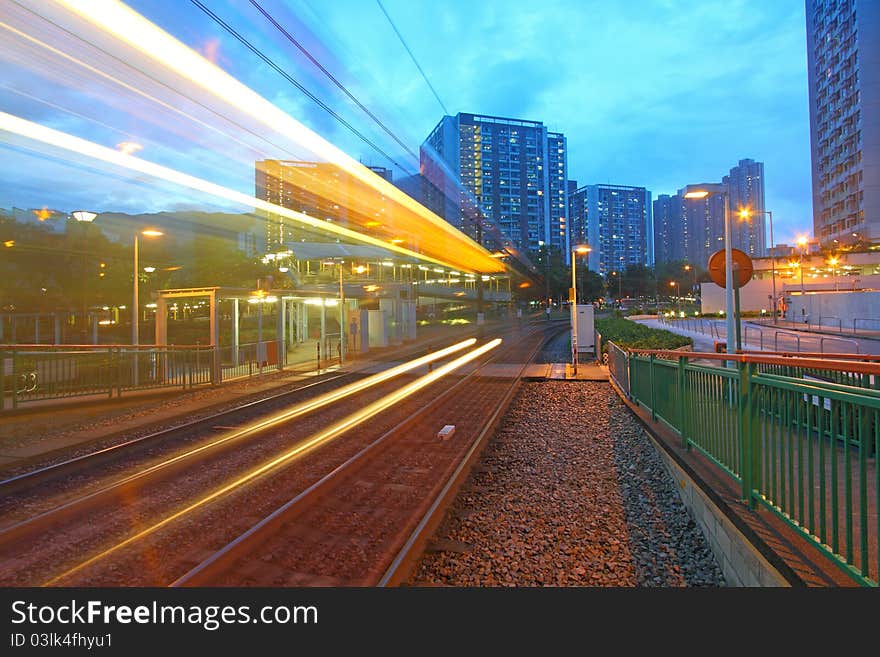 Traffic in Hong Kong at night. Light rail.