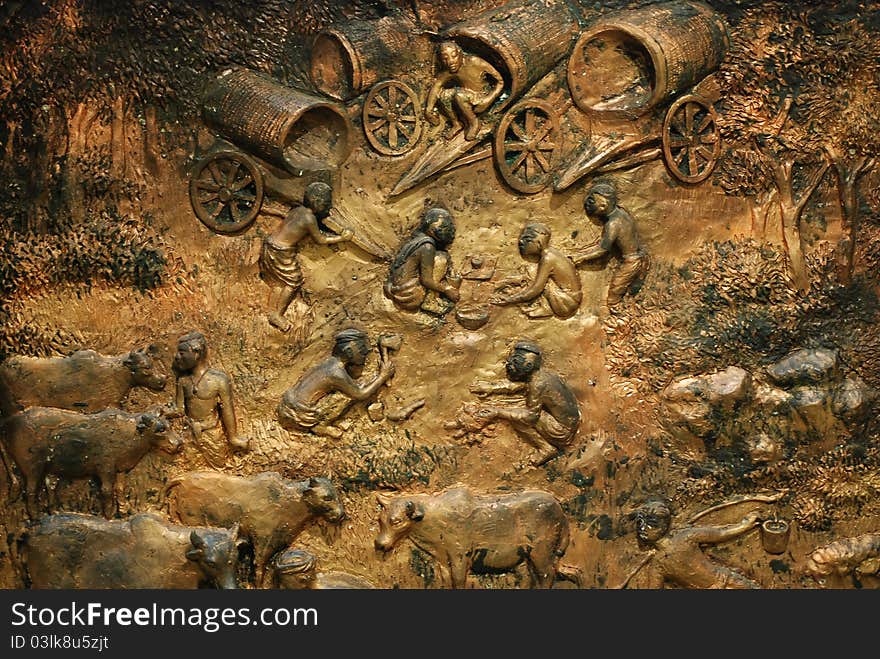 Stucco sculptures wall, The lives of Thai people.