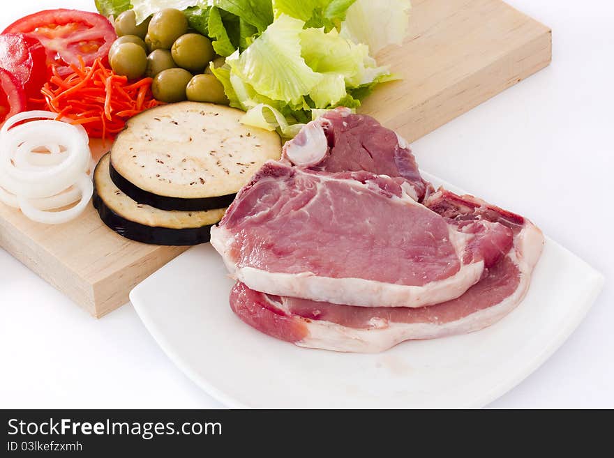 Raw beef fillet with vegetables