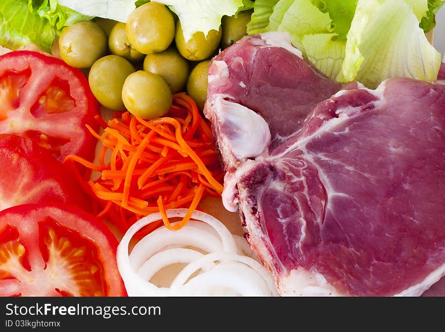 Raw beef fillet with vegetables