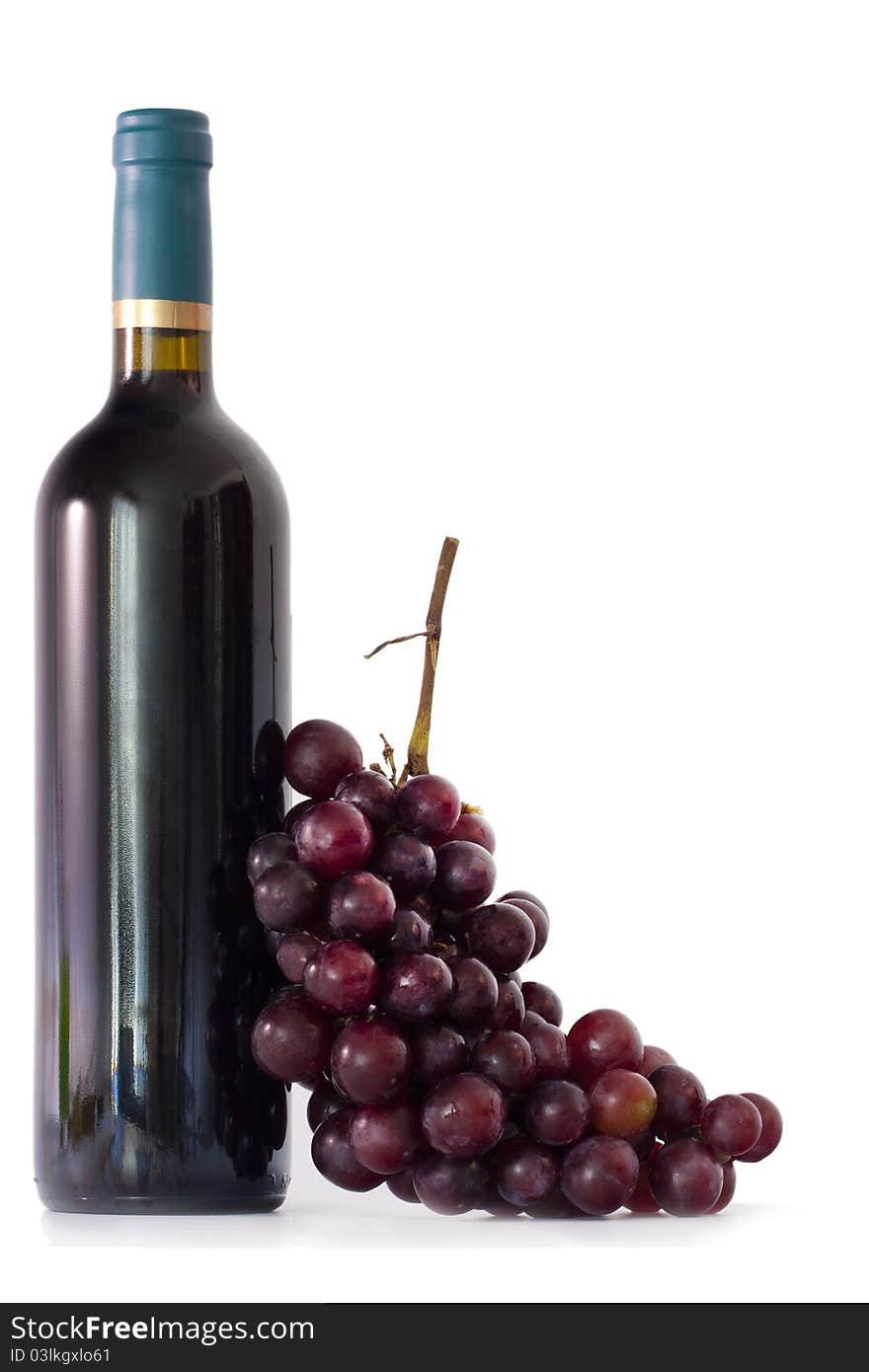 Bottle of wine with grapes