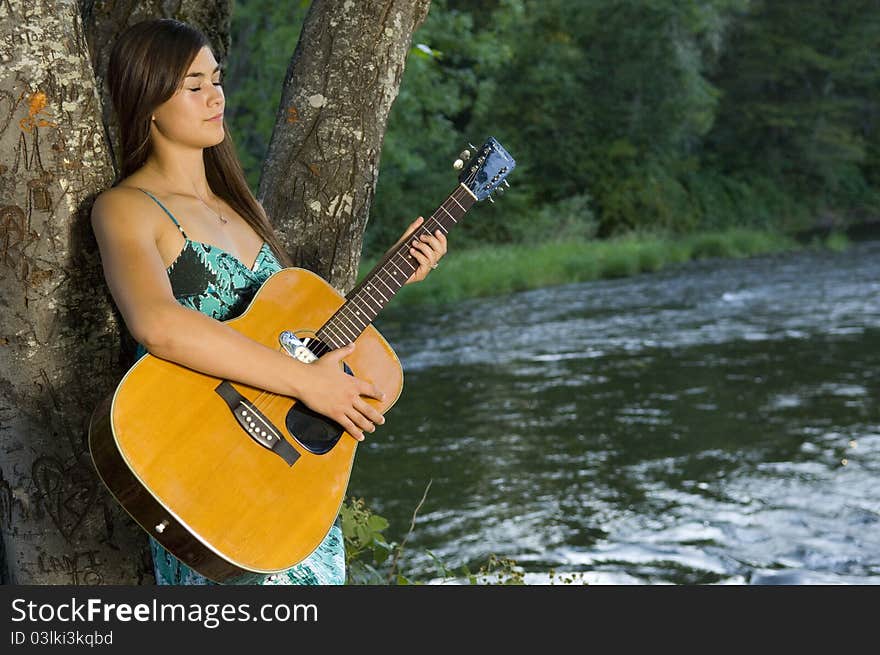 Young woman playing guitar