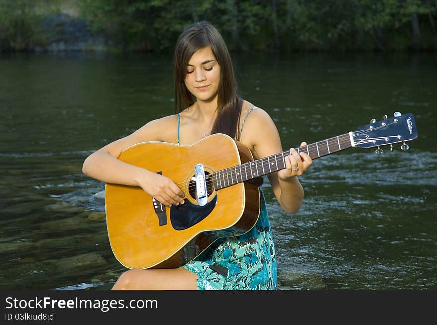 Young Woman Playing Guitar