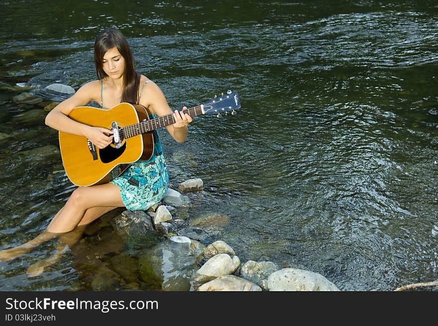 Young Woman Playing Guitar