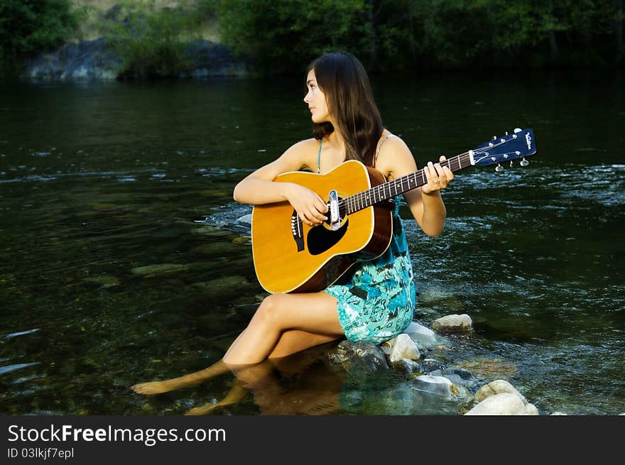 Young woman playing guitar