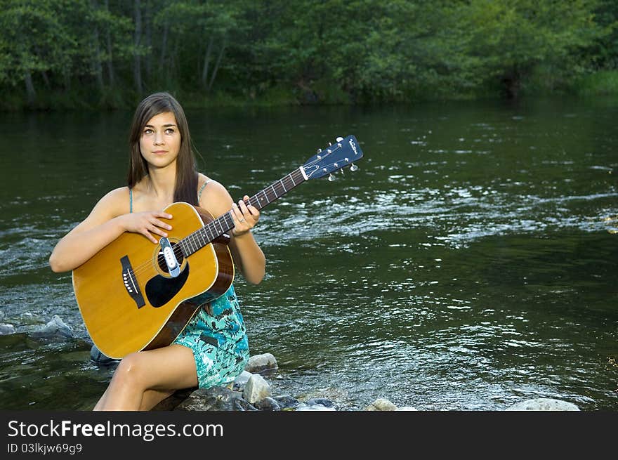 Young woman playing guitar