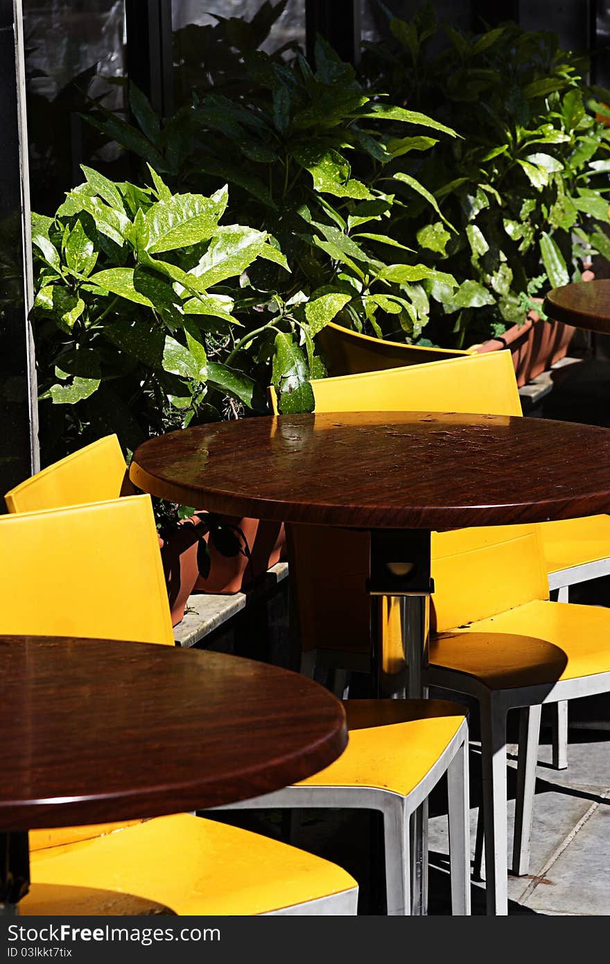 Yellow outdoor cafe after the shower