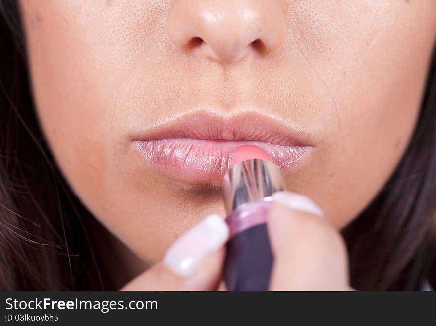 Woman Applying Lipstick