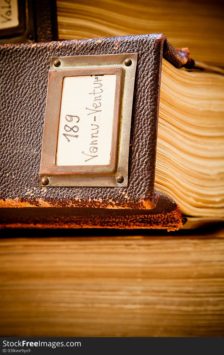 Old leather-bound, hand-written library catalogue. Old leather-bound, hand-written library catalogue.