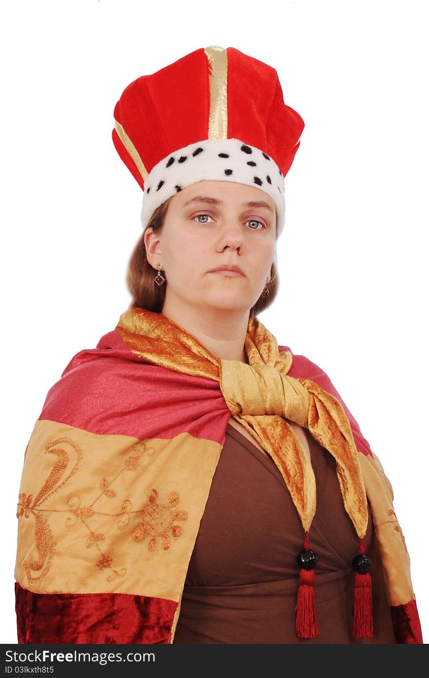 Dressed as a king person posing with a royal half-smile on white background. Dressed as a king person posing with a royal half-smile on white background