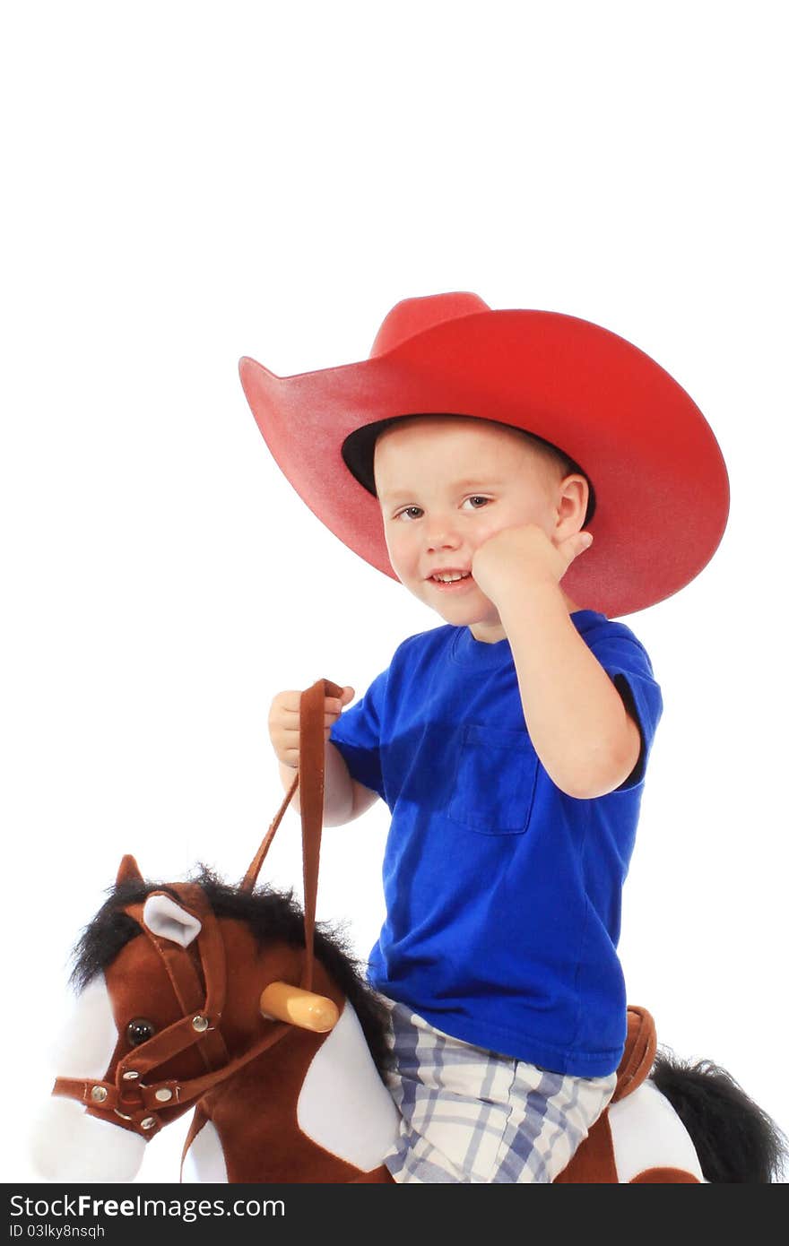 Little cowboy on a rocking horse, isolated on white. Little cowboy on a rocking horse, isolated on white