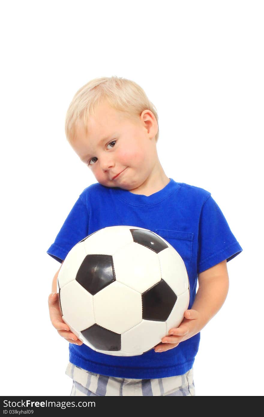 Little boy in a blue shirt with a soccer ball. Little boy in a blue shirt with a soccer ball