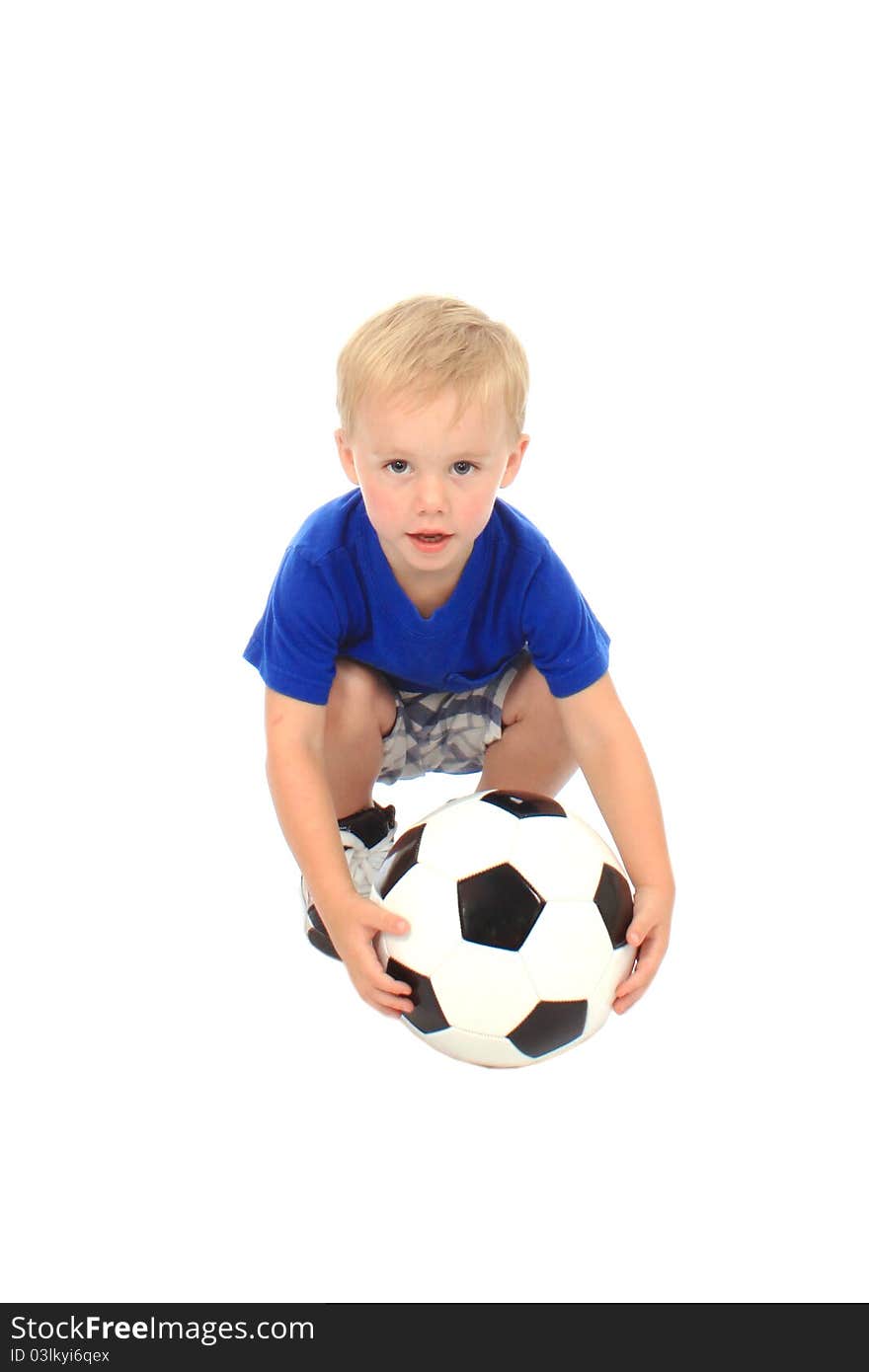 Little boy in a blue shirt with a soccer ball. Little boy in a blue shirt with a soccer ball