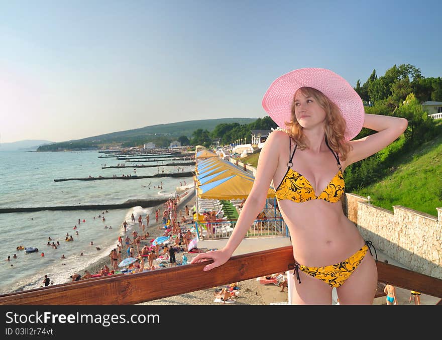 The beautiful girl against the Black Sea beach. Divnomorsky. Russia. The beautiful girl against the Black Sea beach. Divnomorsky. Russia