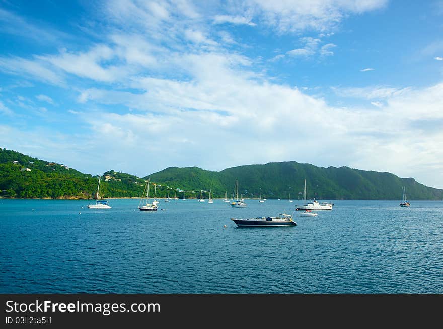 Boats floating in a Caribbean harbor. Boats floating in a Caribbean harbor.