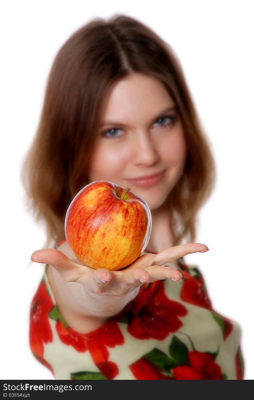 The girl with an apple isolated on white background