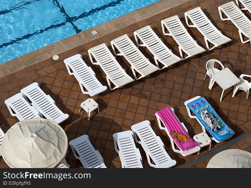 Bird's eye view of a swimming pool from sixth floor on Mediterranean hotel. Bird's eye view of a swimming pool from sixth floor on Mediterranean hotel.