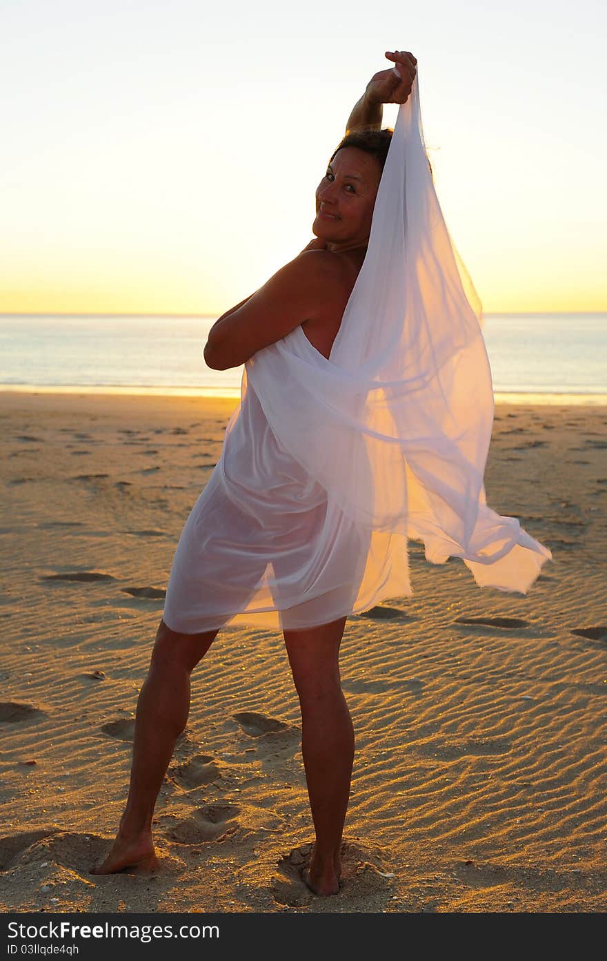 Mature Woman Beach at Sunset