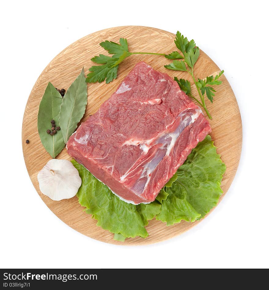 Fresh raw beef steak meat on cutting board in closeup over white background